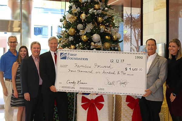 First Foundation donating check to Families Forward